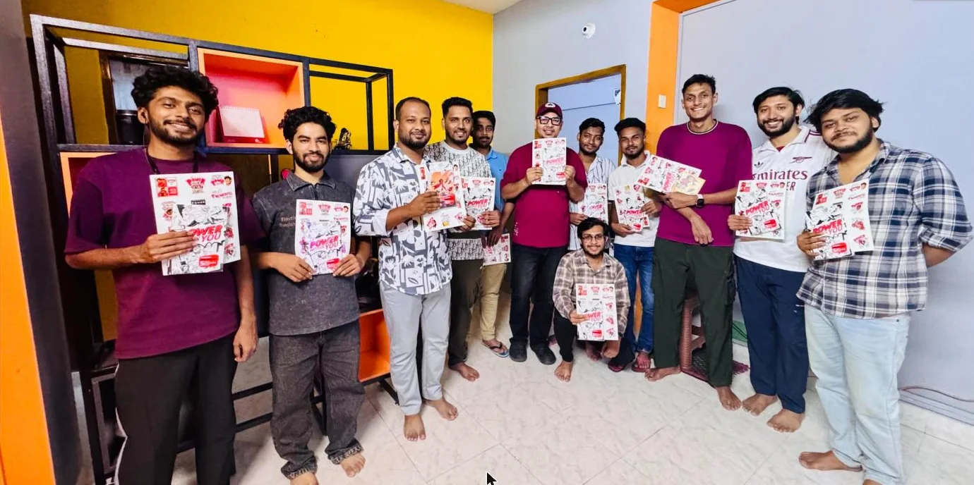 The FireDrum team holding their Power Within You comic books